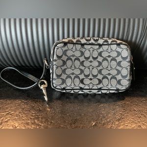Coach signature mini wristlet grey and black with black interior.